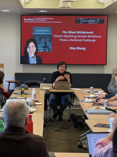 Dian Zhong speaking at an event