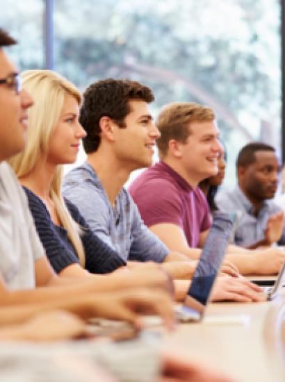 Class Of University Students Using Laptops In Lecture stock photo