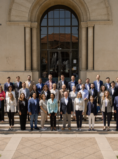 The 2025 cohort of Hoover Institution International Seminar participants are seen outside Hoover Tower with Condoleezza Rice and H.R. McMaster (center) on June 23, 2025. (Patrick Beaudouin)