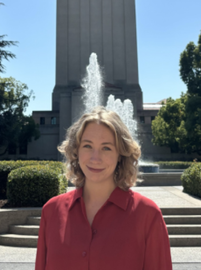 Jenna Mollerus in front of the Hoover Tower