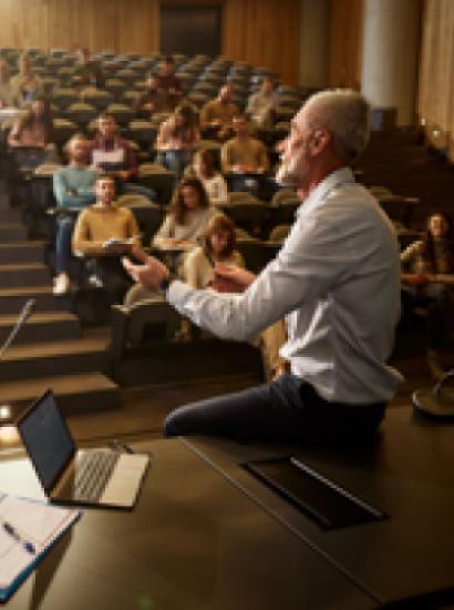 college professor with students istock image