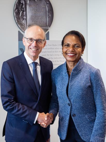 Luxembourg Prime Minister Luc Frieden and Hoover Institution Director Condoleezza Rice shake hands in Hoover’s George P. Shultz Building on November 11, 2025. (Patrick Beaudouin) 
