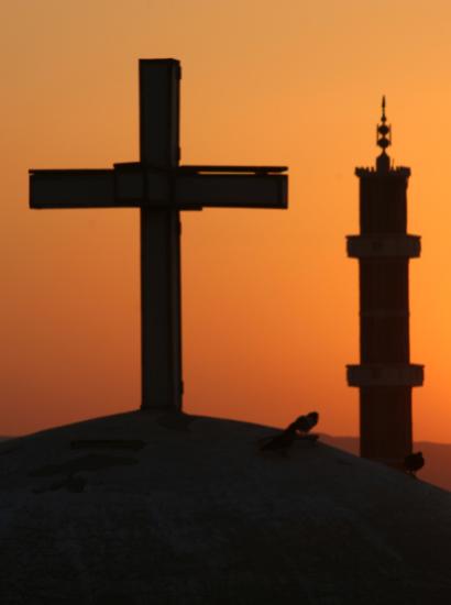 Egyptian sunrise with cross and crescents stock photo