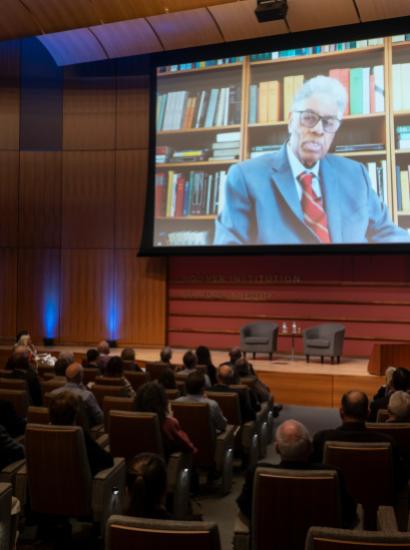 Thomas Sowell speaks on screen inside Hauck Auditorium at a celebration of his career on October 20, 2025. (Patrick Beaudouin)