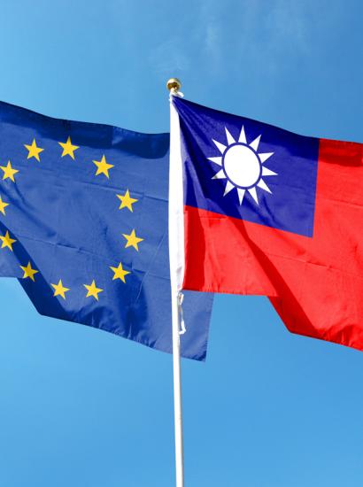 European Union flag and Taiwan flag on cloudy sky. waving in the sky stock photo