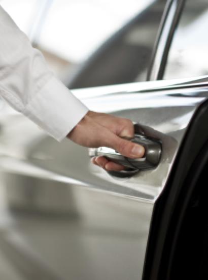 Man opening a car door