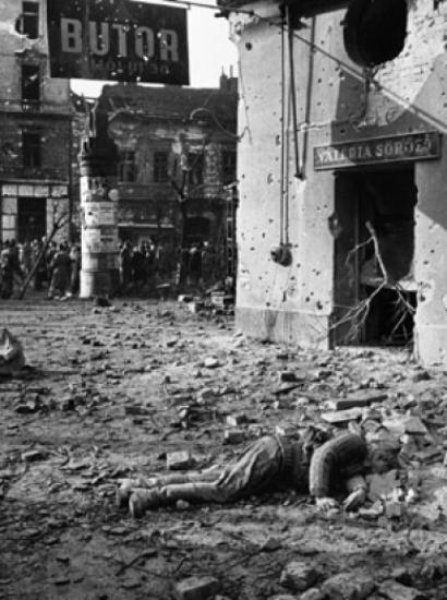 Hungarians with dead Soviet soldier in 1956 uprising