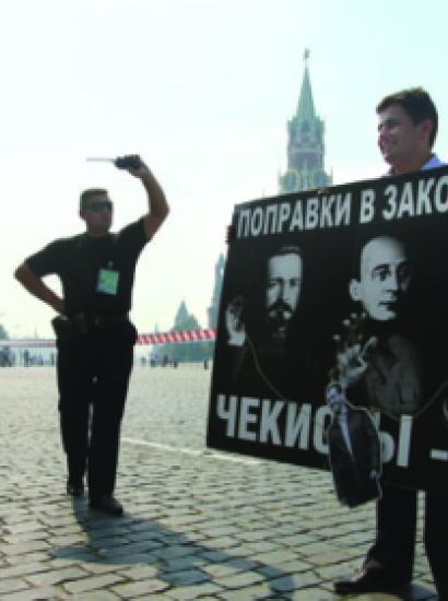 A security officer confronts a Red Square protester