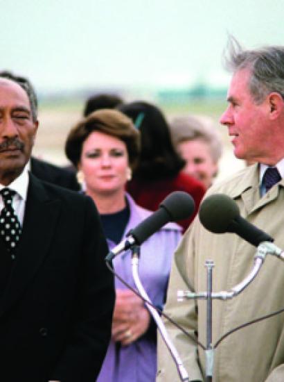 Egyptian President Anwar Sadat, left, arrives at Andrews Air Force Base in 1980