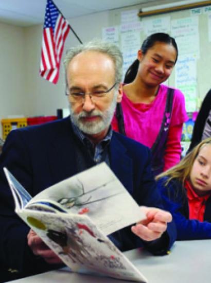Huffman reading to schoolchildren