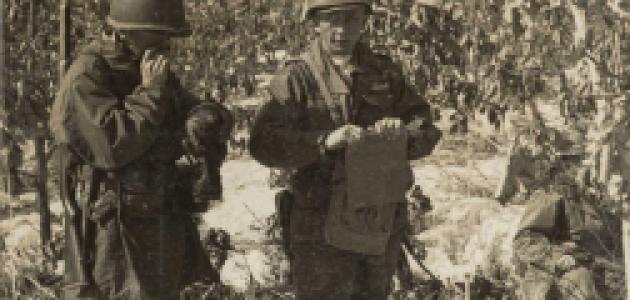 Rasula - sepia toned photo of 2 soldiers in the field