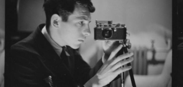 Buchman taking a self-portrait with his camera. Digitized black and white photo negative.