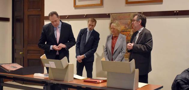 Latvian Ambassador delegation viewing library and archival material