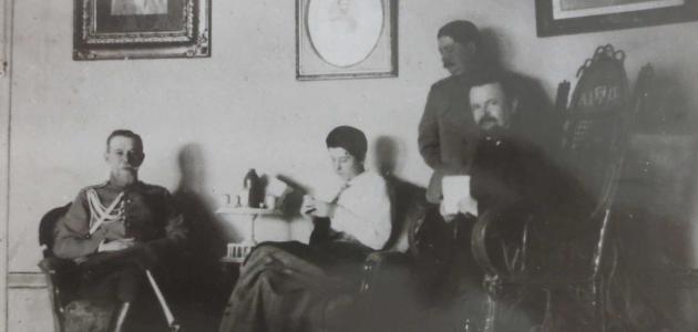 Trubetskoi with group in a sitting room