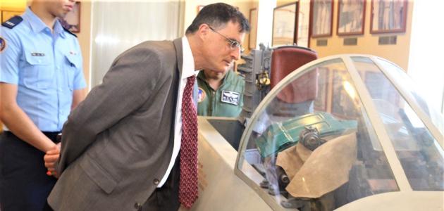 Eric Wakin looking into the cockpit of a plane on display in the American Footprint Museum