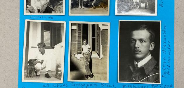 Six black and white photographs adhered to blue paper.