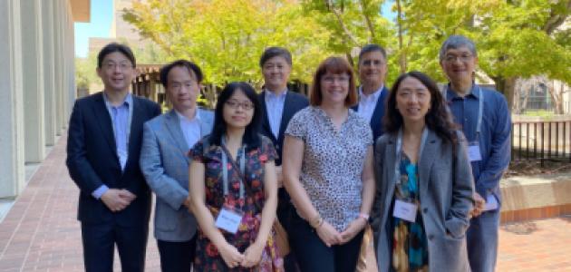 Modern China and Taiwan Workshop 2023 speakers stand in front of Hoover Tower and HHMB