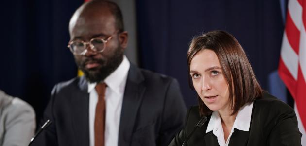 Young confident female politician in formalwear speaking in microphone stock photo (iStock)