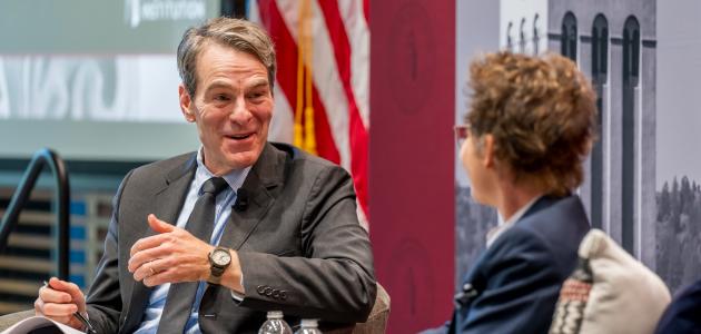 Senior Fellow John H. Cochrane speaks with SF Fed President and CEO Mary C. Daly in Shultz Auditorium on December 6, 2024. (Steve Castillo)