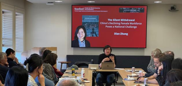 Dian Zhong speaking at an event