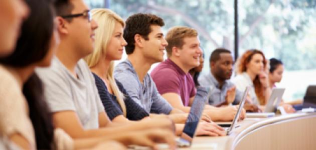 Class Of University Students Using Laptops In Lecture stock photo