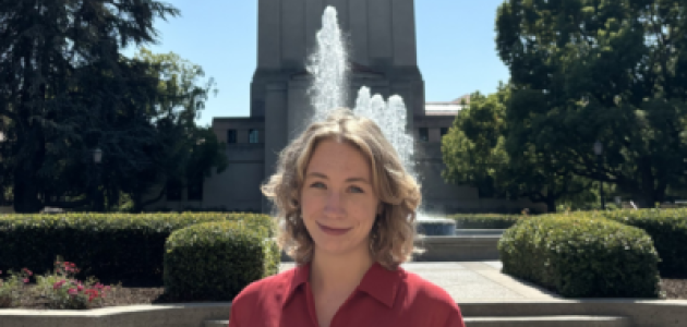 Jenna Mollerus in front of the Hoover Tower