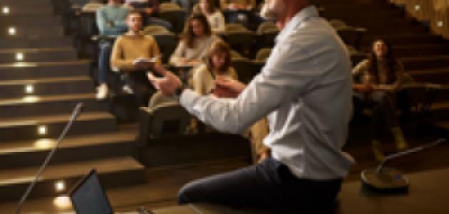 college professor with students istock image