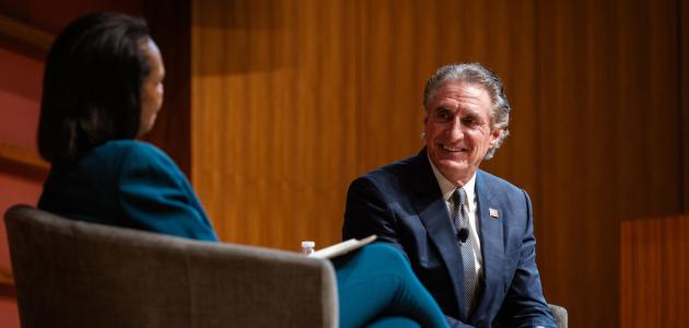 US Secretary of the Interior Doug Burgum is seen in Hauck Auditorium with Hoover Institution Director Condoleezza Rice on October 10, 2025. (Patrick Beaudouin)