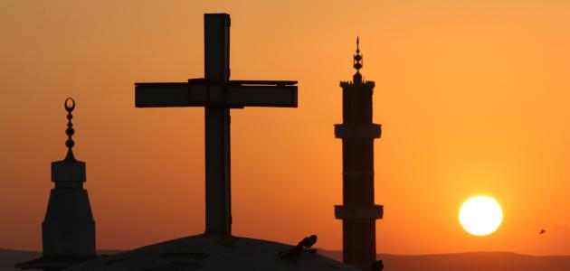 Egyptian sunrise with cross and crescents stock photo