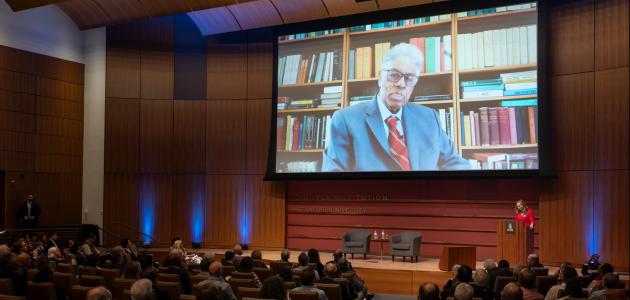 Thomas Sowell speaks on screen inside Hauck Auditorium at a celebration of his career on October 20, 2025. (Patrick Beaudouin)