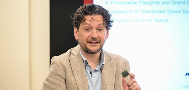 Simone D’Amico speaks to members of Congress and their staff members at an event at Stanford University on May 30, 2024. (Rod Searcey)
