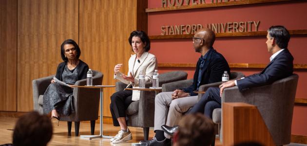 Hoover Institution Director Condoleezza Rice, Former US Commerce Secretary Gina Raimondo, Google-Alphabet executive James Manyika and Former UK Prime Minister and Hoover Distinguished Visiting Fellow Rishi Sunak are seen in Hauck Auditorium on March 17, 2026. (Patrick Beaudouin)
