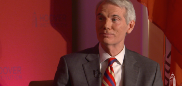 Image of Senator Rob Portman in front an orange-red background