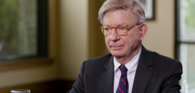 Image of George F. Will sitting at a table.