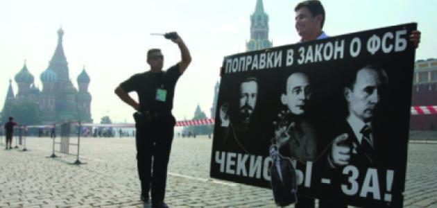 A security officer confronts a Red Square protester