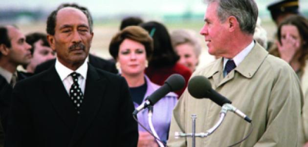 Egyptian President Anwar Sadat, left, arrives at Andrews Air Force Base in 1980