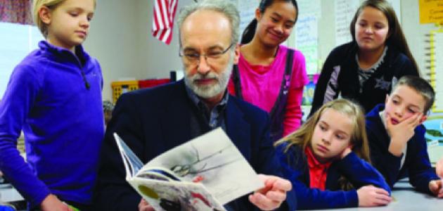 Huffman reading to schoolchildren