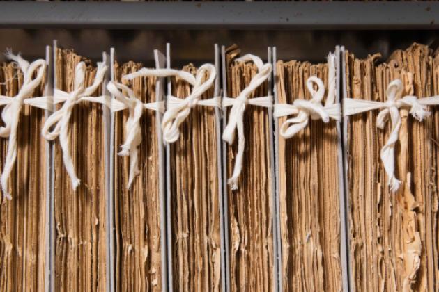 Cotton tied newspapers