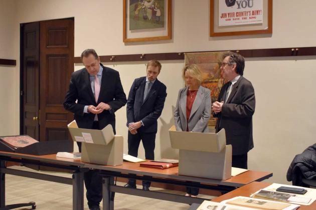 Latvian Ambassador delegation viewing library and archival material