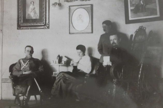 Trubetskoi with group in a sitting room