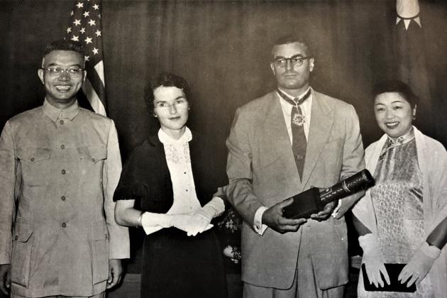 Black and white photograph of Wei Daming (left) and E. S. Belknap (second from right)