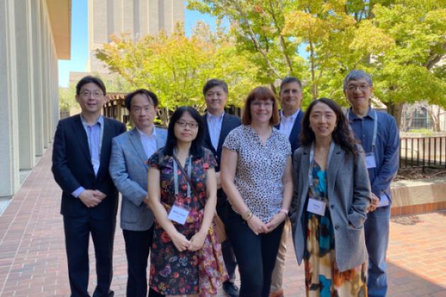 Modern China and Taiwan Workshop 2023 speakers stand in front of Hoover Tower and HHMB