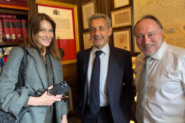 Carla Bruni, former French president Nicholas Sarkozy and Andrew Roberts are seen in London on June 4.