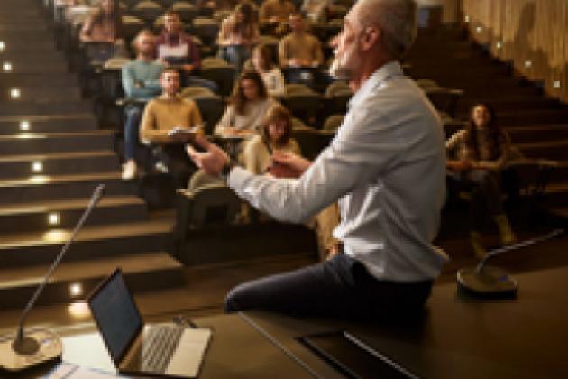 college professor with students istock image