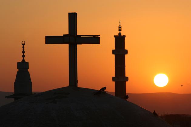 Egyptian sunrise with cross and crescents stock photo