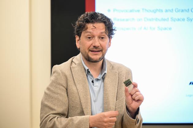 Simone D’Amico speaks to members of Congress and their staff members at an event at Stanford University on May 30, 2024. (Rod Searcey)