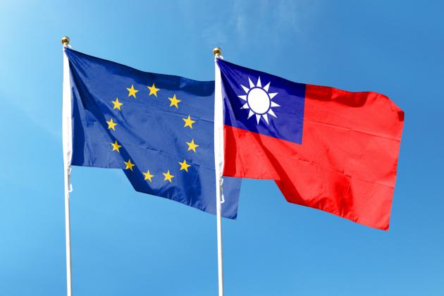 European Union flag and Taiwan flag on cloudy sky. waving in the sky stock photo