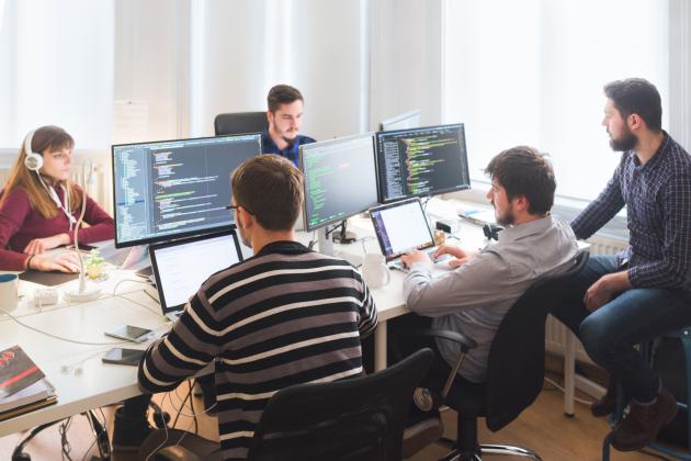 Software developing team working in the office stock photo