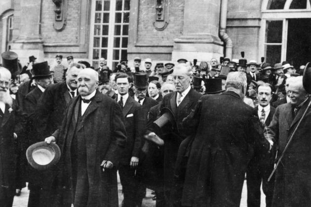 1919: French prime minister Georges Clemenceau (1841 - 1929) (L), US president Woodrow Wilson (1856 - 1924) (C) and British prime minister David Lloyd George (1863 - 1945) attend negotiations for the Treaty of Versailles. (Photo by Hulton Archive/Getty Images)