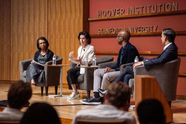 Hoover Institution Director Condoleezza Rice, Former US Commerce Secretary Gina Raimondo, Google-Alphabet executive James Manyika and Former UK Prime Minister and Hoover Distinguished Visiting Fellow Rishi Sunak are seen in Hauck Auditorium on March 17, 2026. (Patrick Beaudouin)